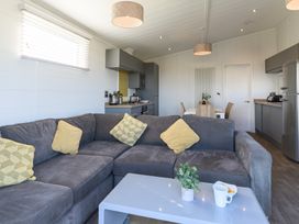 A living room with a sofa and coffee table at Blencathra Family (Pet) Penrith