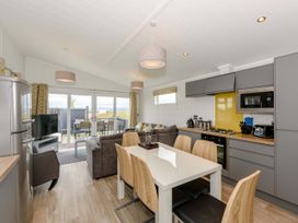 A kitchen with dining area and living space at Blencathra Family (Pet) in Penrith