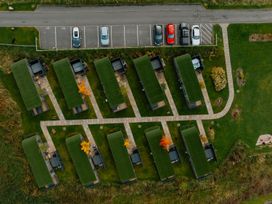 A layout of cabins with a parking lot at Keswick Penrith