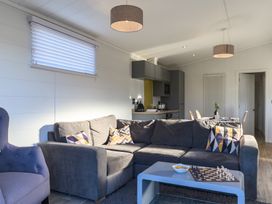 A living room with a sofa and chessboard at Grasmere (Pet) Penrith