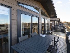 An outdoor area with a table and chairs at Keswick (Pet) Penrith