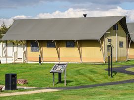 A tent with signage and pathway at Savannah in Penrith