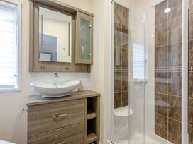A bathroom with a sink and shower at Helvellyn in Penrith
