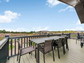 An outdoor deck with table and chairs at Helvellyn (Pet) Penrith