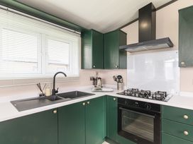 A kitchen with a sink and cooker at Blencathra Spa (Pet) in Penrith
