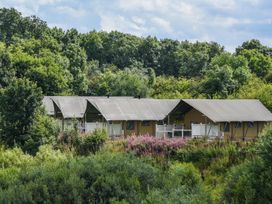 Canvas tents with wooden deck and railings at Kruger in Penrith