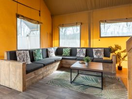 A living room with a sofa and coffee table at Kruger in Penrith