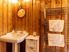 A bathroom with a sink and towel rack at Kruger in Penrith