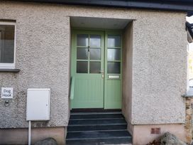 An entrance with a green front door and a dog hook at Renes Shop in Grange-Over-Sands
