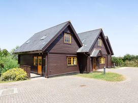 A house with a garden and pathway at Scandinavian Lodge 4 in Portreath