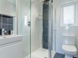 A bathroom with a shower and sink at Signature Lodge Pet 4 in Portreath
