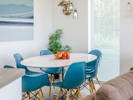A dining area with a round table and chairs at Signature Assisted Living 5 Portreath