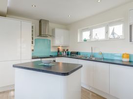 A kitchen with a counter and sink at Signature Lodge Pet 6 in Portreath