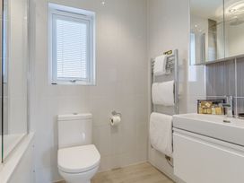A bathroom with a toilet, sink and shower at Signature Lodge Pet 6 in Portreath