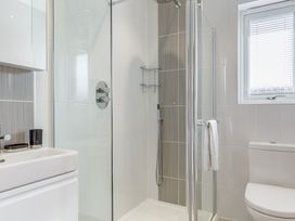 A bathroom with a shower and sink at Signature Lodge Pet 6 Portreath
