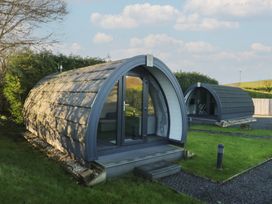 Two holiday pods with glass doors at Pod 9 (No Pets) Tewitfield near Carnforth