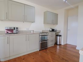 A kitchen with appliances and countertops at Fluta in Seaton