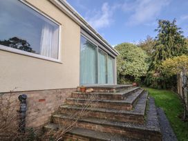 A garden with a staircase leading to a building at Fluta in Seaton