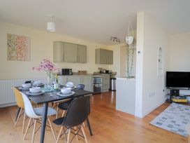 A dining room with a table set for dinner at Fluta Seaton