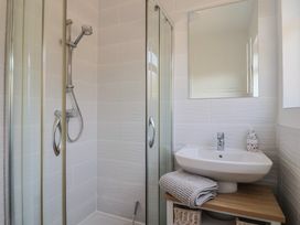 A bathroom with a shower and sink at Fluta in Seaton