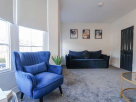 A living room with furniture in 2 bed Scarborough