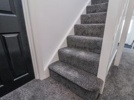 Stairs with carpet leading up to upper level at 2 bed Scarborough