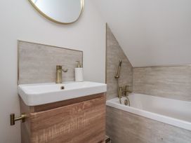 A bathroom with a sink and bathtub at 2 bed Scarborough