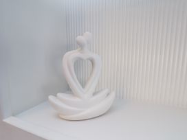 A sculpture displayed on a shelf at 2 bed in Scarborough