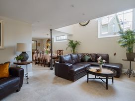 A living room with a sofa and table at The School House in Newton Abbot