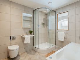 A bathroom with a shower, toilet, sink and bathtub at The School House in Newton Abbot
