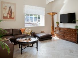 A living room with a coffee table and sofa at Upper School House in Newton Abbot