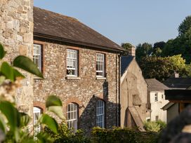 A view of buildings and plants at Upper School House in Newton Abbot