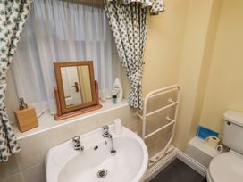 A bathroom with a sink and a toilet at Grange Cottage in Belford