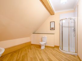 A bathroom with a shower and toilet at Foresters Spa Plus in Dundee