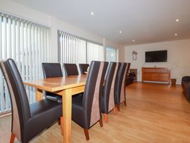 A dining room with a table and chairs at 65 Benasa Lodge near St Columb Major
