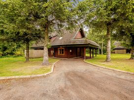 A house surrounded by trees at Eagle Spa Plus in Dundee
