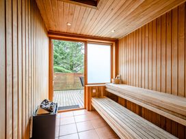 A sauna with wooden benches and a window at Foresters Spa Plus (Pet) Dundee