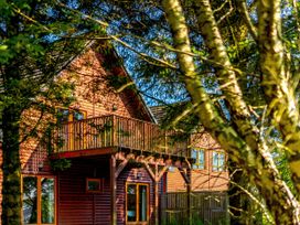A wooden house with a balcony at The Braveheart in Dundee