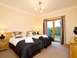 A bedroom with two beds and a window at The Braveheart in Dundee