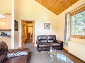 A living room with a sofa and coffee table at Barnard Spa (Pet) Dundee