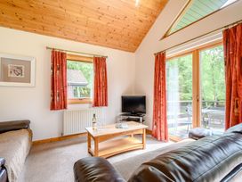 A living room with a sofa and coffee table at Osprey Lodge in Dundee