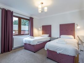 A bedroom with two beds and a window at Galbraith Premier Spa in Dundee