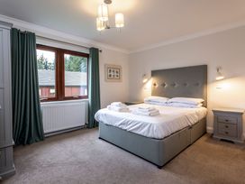 A bedroom with a double bed and window at Galbraith Premier Spa (Pet) Dundee