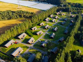 An overview of cabins and fields at Galbraith Premier Spa (Pet) in Dundee