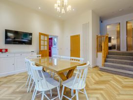 A dining room with a table and chairs at Lochside Premier Spa Dundee