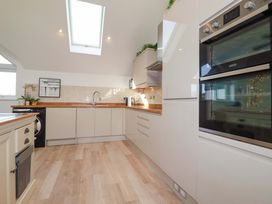 A kitchen with appliances and a skylight at 33 Fordh Tobmen St. Agnes