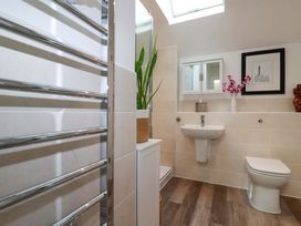 A bathroom with a towel radiator and sink at 33 Fordh Tobmen St. Agnes
