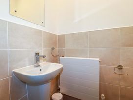 A bathroom with sink and mirror at 33 Fordh Tobmen St. Agnes