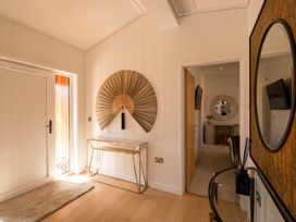 A hallway with a fan on the wall at Moonlight Spa Luxury in Waltham