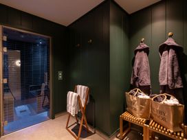 A spa area with a sauna door and seating at Moonlight Spa Luxury in Waltham
